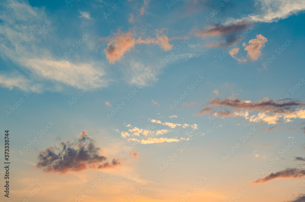 Beautiful summer sky full of clouds at sunset at golden hour. Interesting warm colors on the horizon. Beautiful summer sky full of clouds at sunset at golden hour. Interesting warm colors on the horizon.