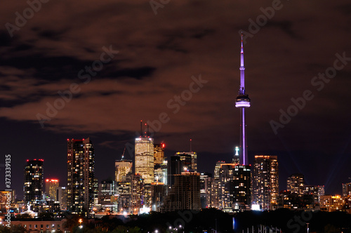 Wallpaper Mural Cityscape of Toronto at night with colored CN Tower and highrise tower lights Torontodigital.ca