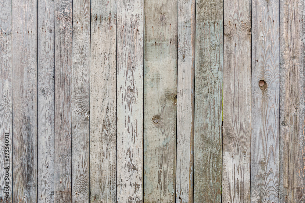abstract background of an old painted wooden fence close up