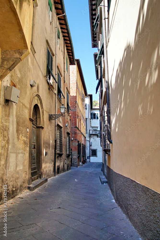 Narrow residential street in the historic part of Lucca, Italy