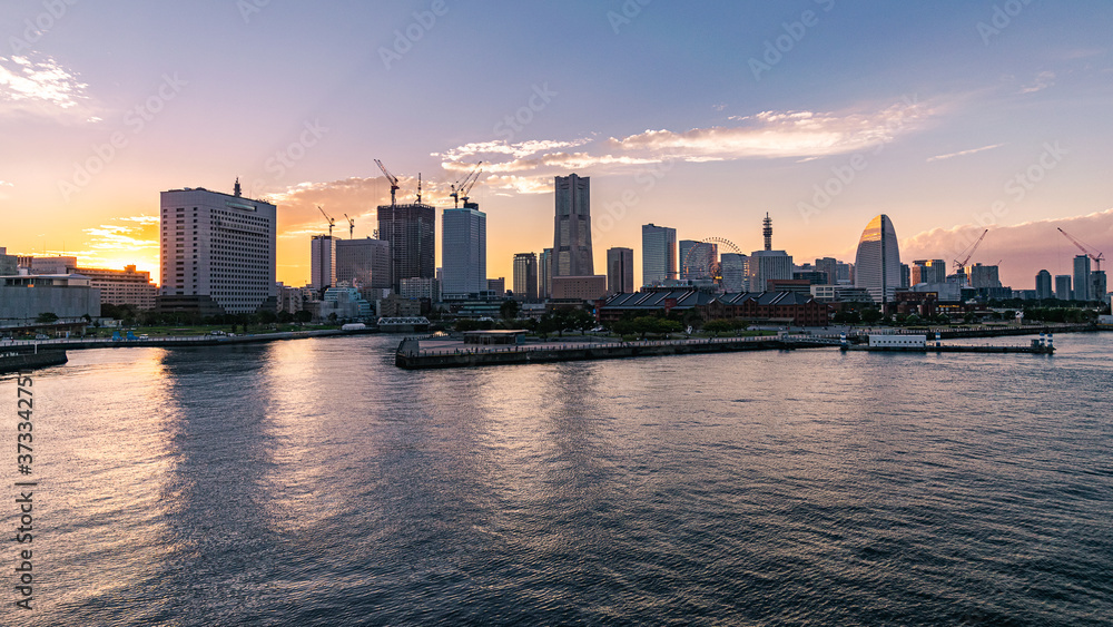Colorful sunset over the buildings at the Yokohama Ferry Terminal.