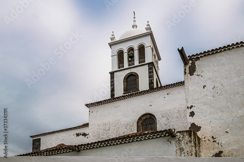 Old colonial church against overcast sky in Garachico village in Tenerife, Canary Islands, Spain. photo
