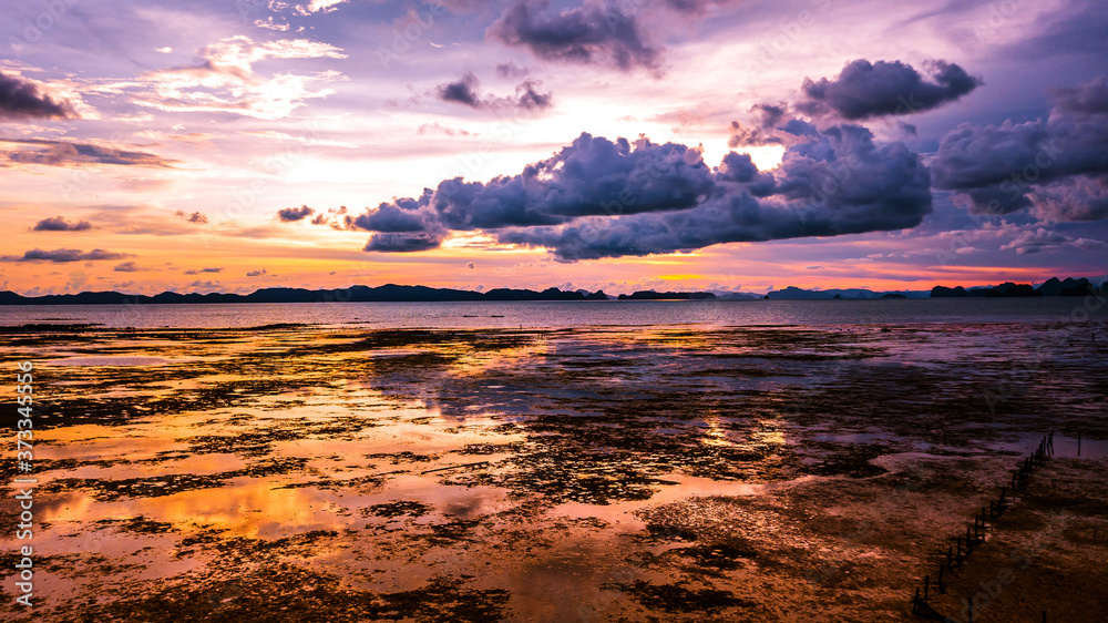 Low tide at the beach  during sunset , Thailand