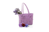 wicker bag with lavender flowers isolated on white
