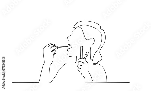 Woman taking smear for COVID-19 test herself