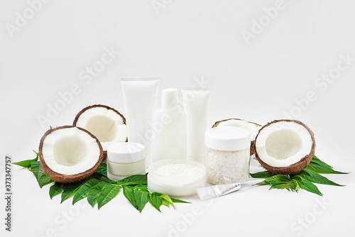Natural organic homemade cosmetics with coconut. Skin care. Spa salon and treatments. Beautician background. Clay, lemon, beauty products.Tropical summer concept. Flat lay, copy space. Coconut milk