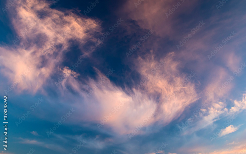 Plumose clouds on sunset, nature background Plumose clouds on sunset, nature background
