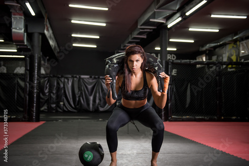 Portrait of female athlete working at the gym