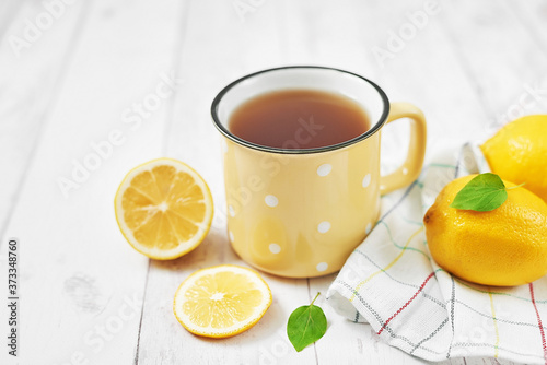 Tea with lemon. Cup of tea. Cozy morning. Healthy breakfast. Good morning. Health prevention. Vitamins. Citruses for colds, copy space. Aromatherapy. Food mood. Food and drink, still life health care