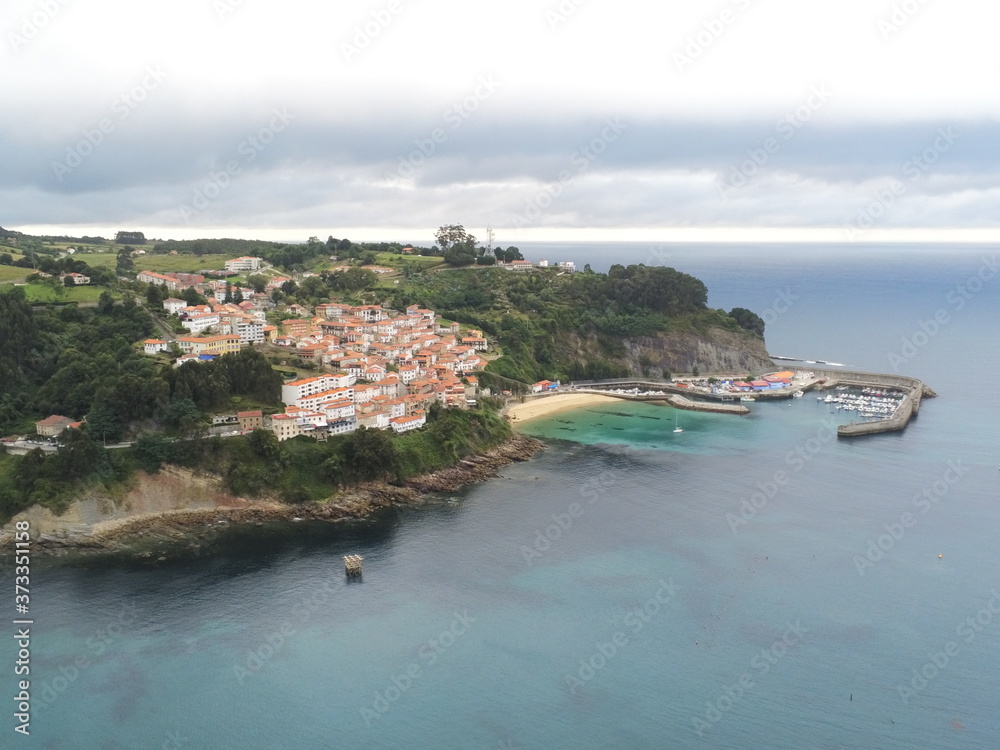 Fototapeta premium Beautiful beach in Lastres. Asturias. Colunga, Spain. Aerial Drone Photo