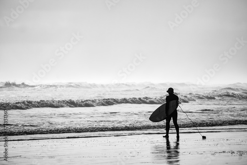 Surfer entering the ocean