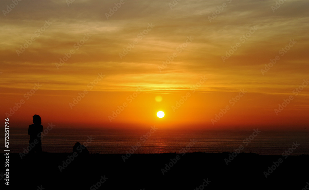 Sunset on the green coast of Lima.