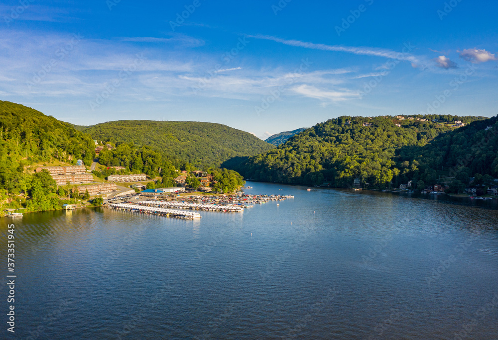 Obraz premium Wide panoramic view of Cheat Lake near Morgantown in West Virginia from aerial drone shot above the water