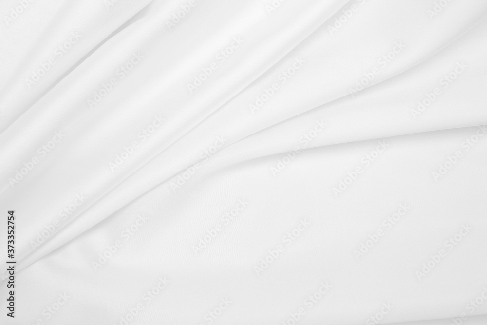 Naklejka premium Smooth elegant white silk or satin luxury cloth texture as wedding background. Luxurious background design