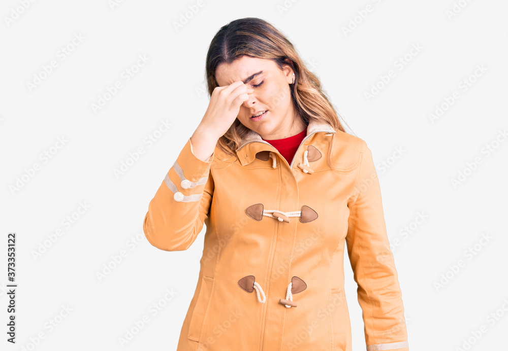 Young caucasian woman wearing casual clothes tired rubbing nose and eyes feeling fatigue and headache. stress and frustration concept. Young caucasian woman wearing casual clothes tired rubbing nose and eyes feeling fatigue and headache. stress and frustration concept.