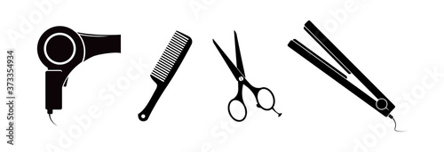 Hairdryer, scissors, comb and hair straightener. Hairdressing accessories.
