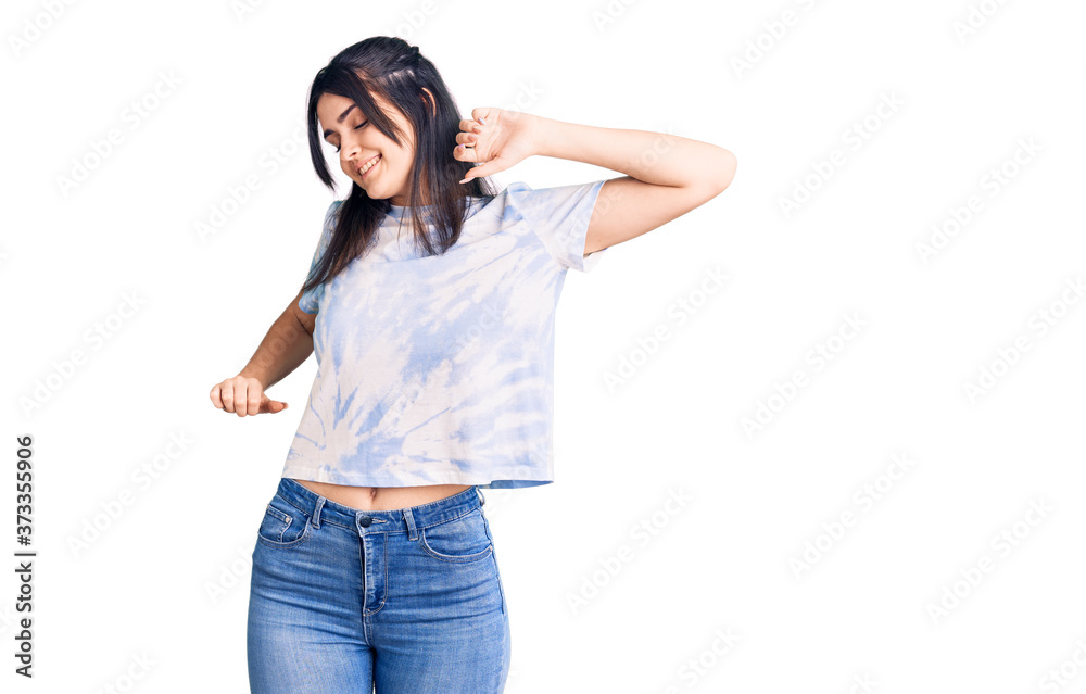 Young beautiful girl wearing casual t shirt stretching back, tired and relaxed, sleepy and yawning for early morning Young beautiful girl wearing casual t shirt stretching back, tired and relaxed, sleepy and yawning for early morning