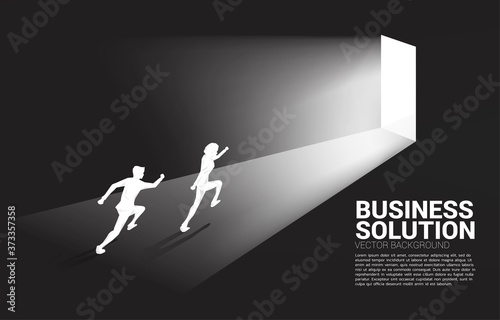 Silhouette of businessman running to exit door. Concept of career start up and business solution.