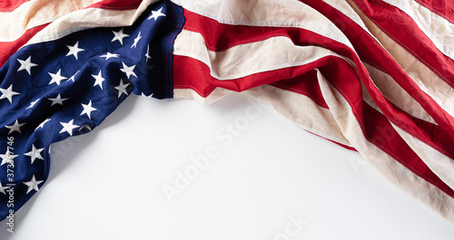 American flags against white background. Flat lay with copy space. Happy Labor Day concept. photo