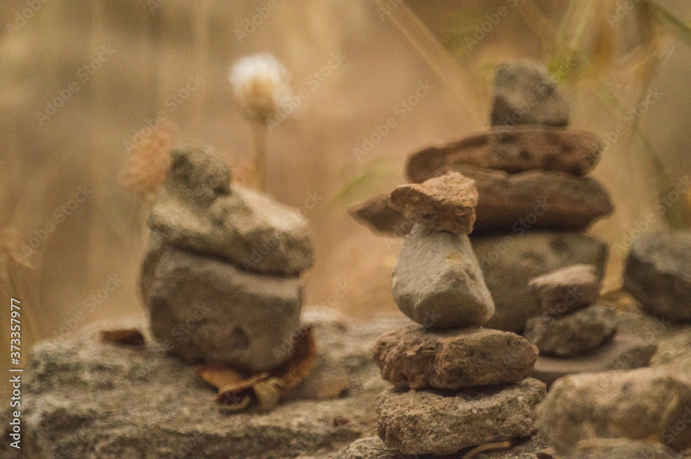 Small mounds of stones overlapping with balance Small mounds of stones overlapping with balance