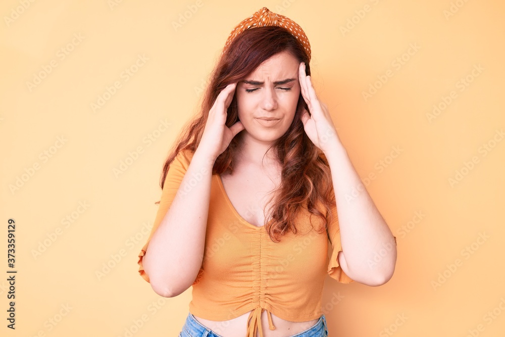Young beautiful woman wearing casual clothes with hand on head for pain in head because stress. suffering migraine.