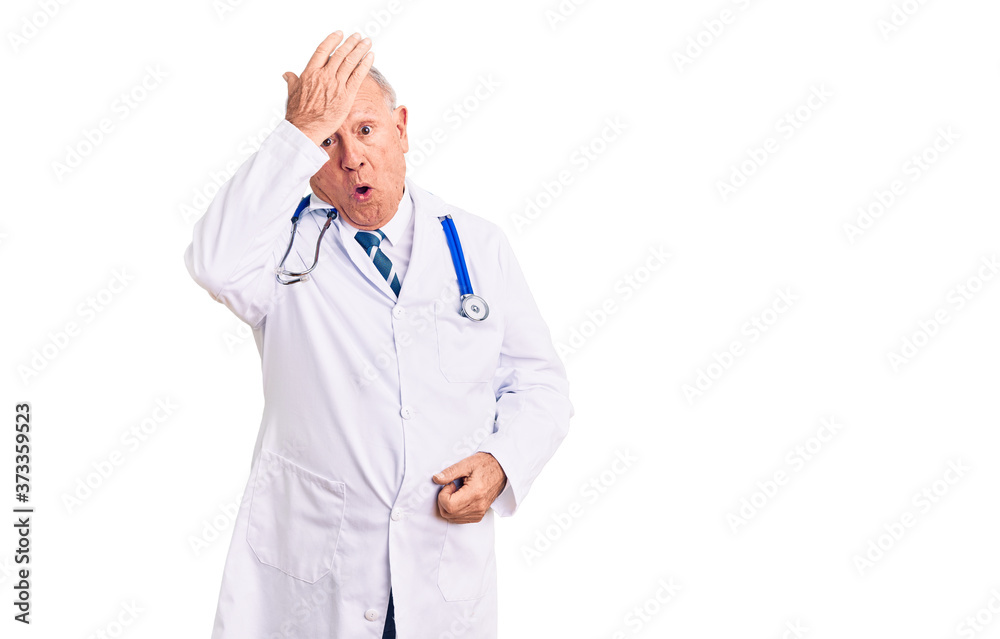 Senior handsome grey-haired man wearing doctor coat and stethoscope surprised with hand on head for mistake, remember error. forgot, bad memory concept. Senior handsome grey-haired man wearing doctor coat and stethoscope surprised with hand on head for mistake, remember error. forgot, bad memory concept.