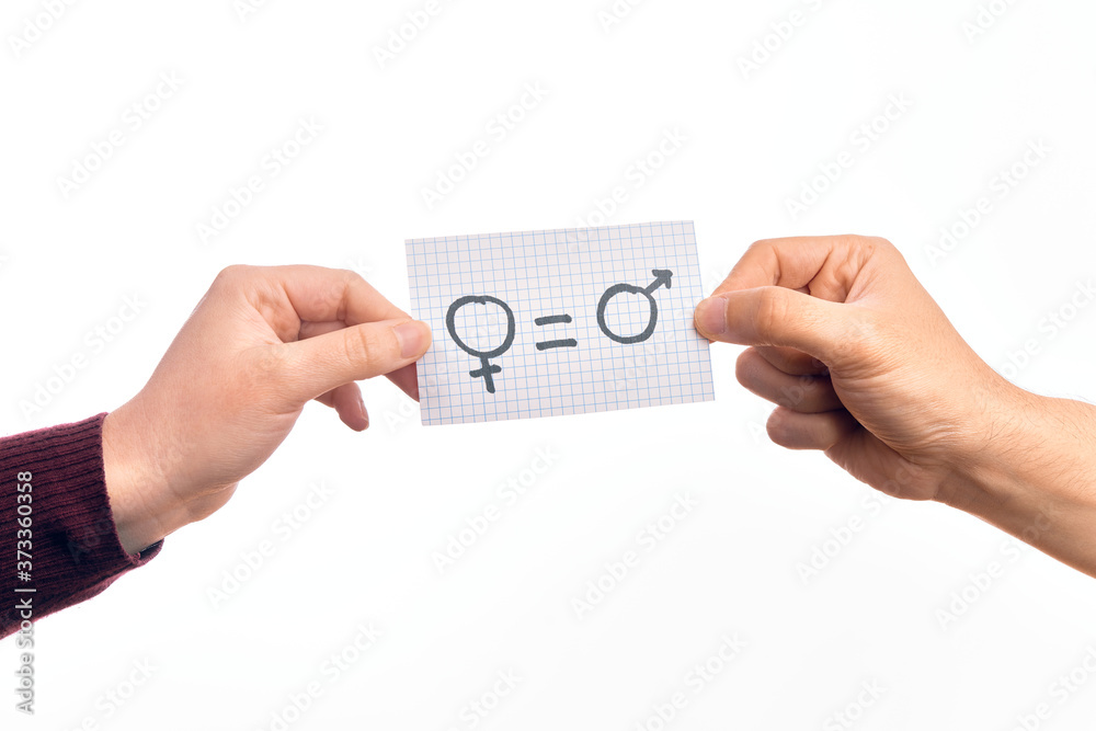 Cardboard banner with female and male symbol, women and men are equal message over isolated white background Cardboard banner with female and male symbol, women and men are equal message over isolated white background
