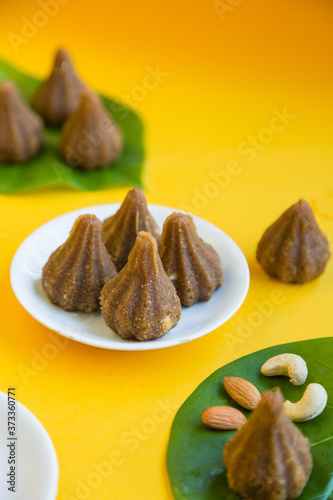 Modak is a tradtional Indian sweet dumpling offered to Elephant God Ganapati on Ganesh Chaturthi Festival. Made from rice flour and coconut jaggery filling.