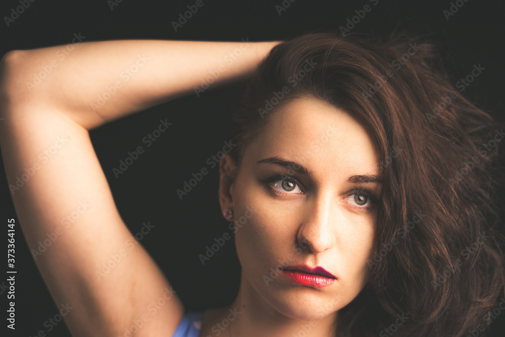 Fototapeta premium Beautiful female studio portrait with black background 