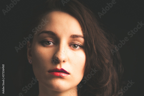 Advertising portrait of a young woman with makeup photo