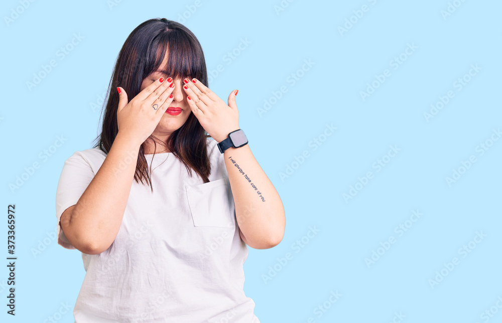 Young plus size woman wearing casual clothes rubbing eyes for fatigue and headache, sleepy and tired expression. vision problem Young plus size woman wearing casual clothes rubbing eyes for fatigue and headache, sleepy and tired expression. vision problem