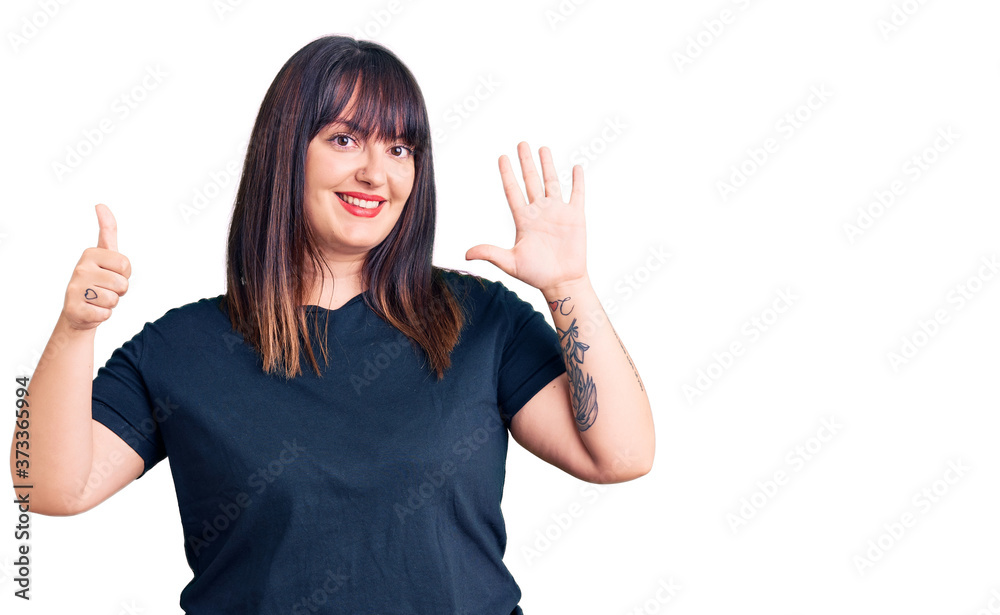 Young plus size woman wearing casual clothes showing and pointing up with fingers number six while smiling confident and happy. Young plus size woman wearing casual clothes showing and pointing up with fingers number six while smiling confident and happy.