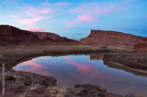 Pink skies reflect in the Colorado river near Moab.
