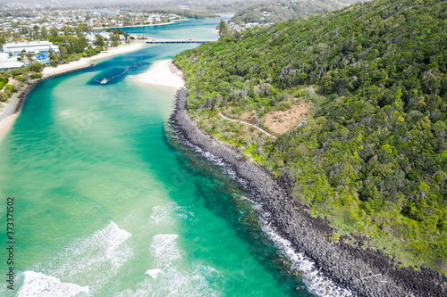 Burleigh Heads National Park aerial image with Tallebudgera creek and sand pumping dredging boat