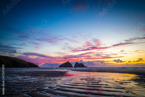 Gull rocks at sunset in Hollywell Bay in Cornwall photo