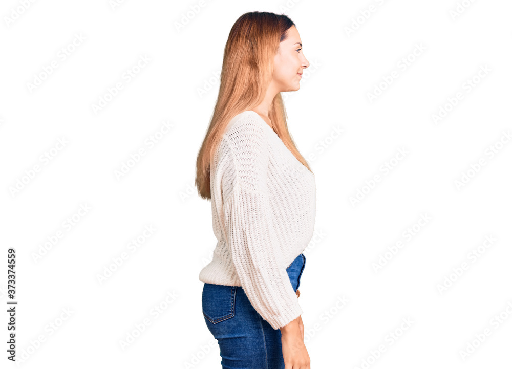 Beautiful young woman wearing casual clothes looking to side, relax profile pose with natural face with confident smile. Beautiful young woman wearing casual clothes looking to side, relax profile pose with natural face with confident smile.