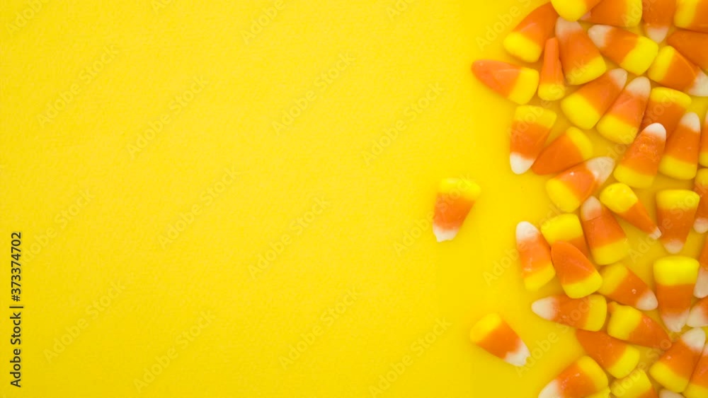 Stop Motion Animation of Orange and Yellow Candy Corn Background