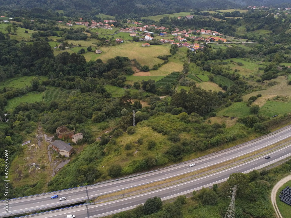 Road in landscape of Colunga, Asturias,Spain. Aerial Drone Photo