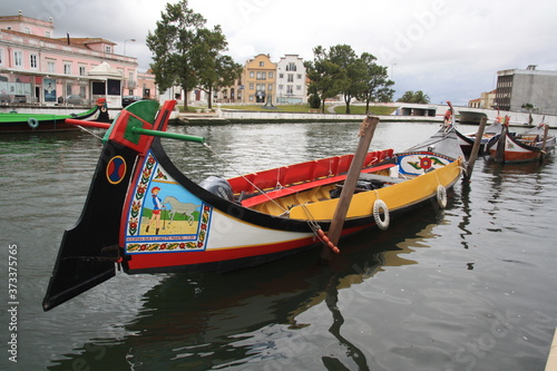 Traditional boats, Colorful Moliceiro boat, on the canal in Aveiro, Portugal.