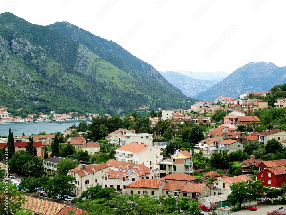 Aerial view of Kotor bay and old city in Kotor, Montenegro. Kotor is a coastal town in a secluded Gulf of Kotor, its preserved medieval old town is an UNESCO World Heritage Site. 