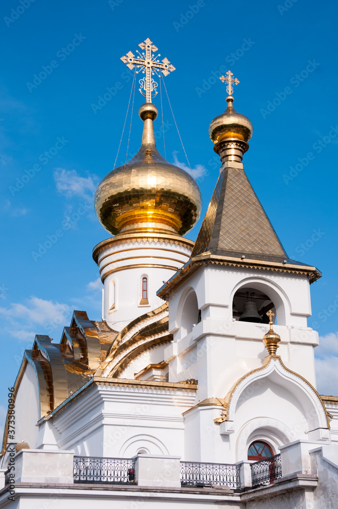 Khabarovsk, Russia, July 31, 2020:Seraphim of Sarov temple against the blue sky in summer in the Northern Park of Khabarovsk