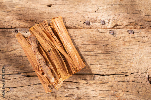 stack of palo santo wood on the table (Bursera graveolens) photo