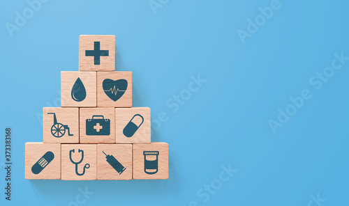 Wood block stacking with icon healthcare medical, Insurance for your health concept photo