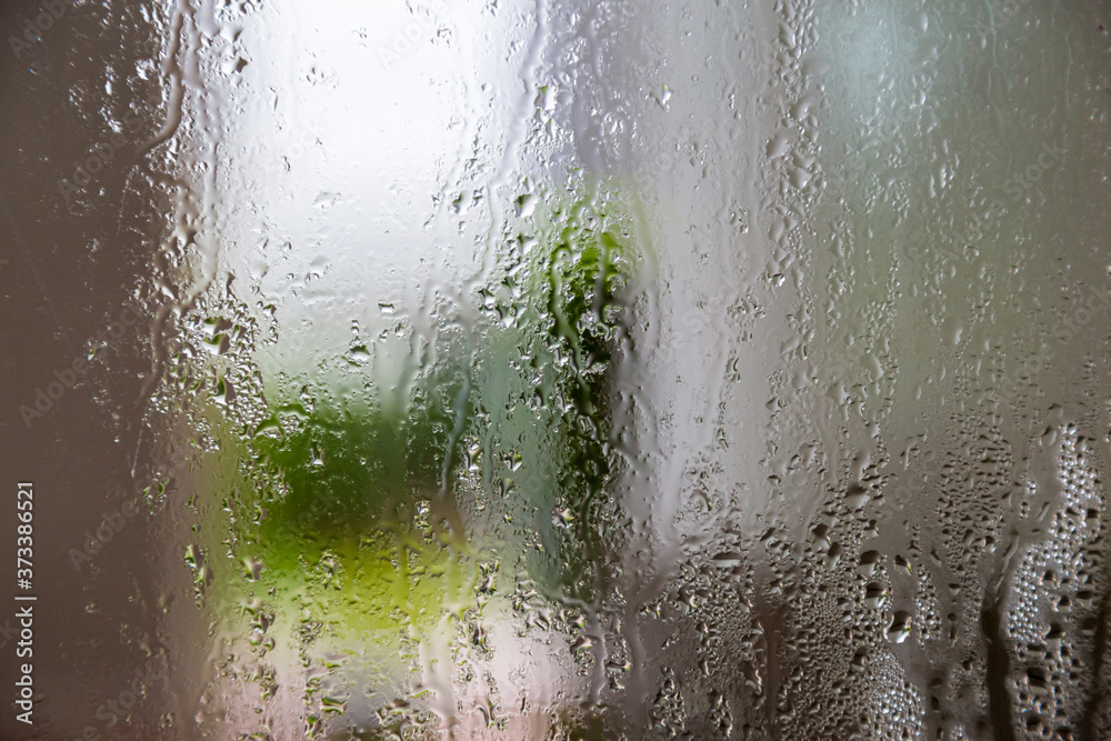 natural behind the wet glass