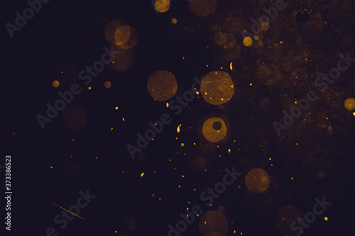 Dark Abstract Gold bokeh sparkle on black © pandaclub23