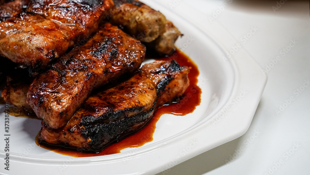Grilled Pork Chops on White Plate Grilled Pork Chops on White Plate