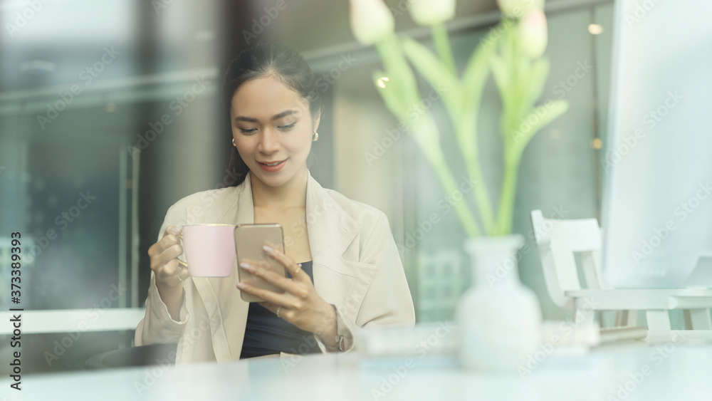 Portrait of female relaxing with smartphone while take a break with coffee Portrait of female relaxing with smartphone while take a break with coffee