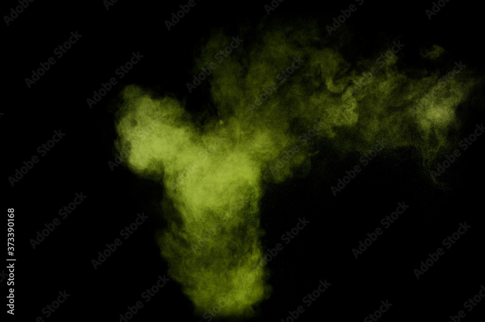 Light green powder explosion on black background. Colored powder cloud. Colorful dust explode. Paint  Holi.