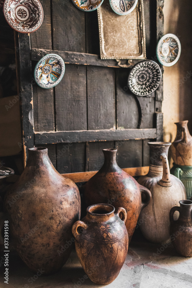 Many unique handmade clay jugs and vases on local arabian market. Souk in medina Marrakech. Many unique handmade clay jugs and vases on local arabian market. Souk in medina Marrakech.