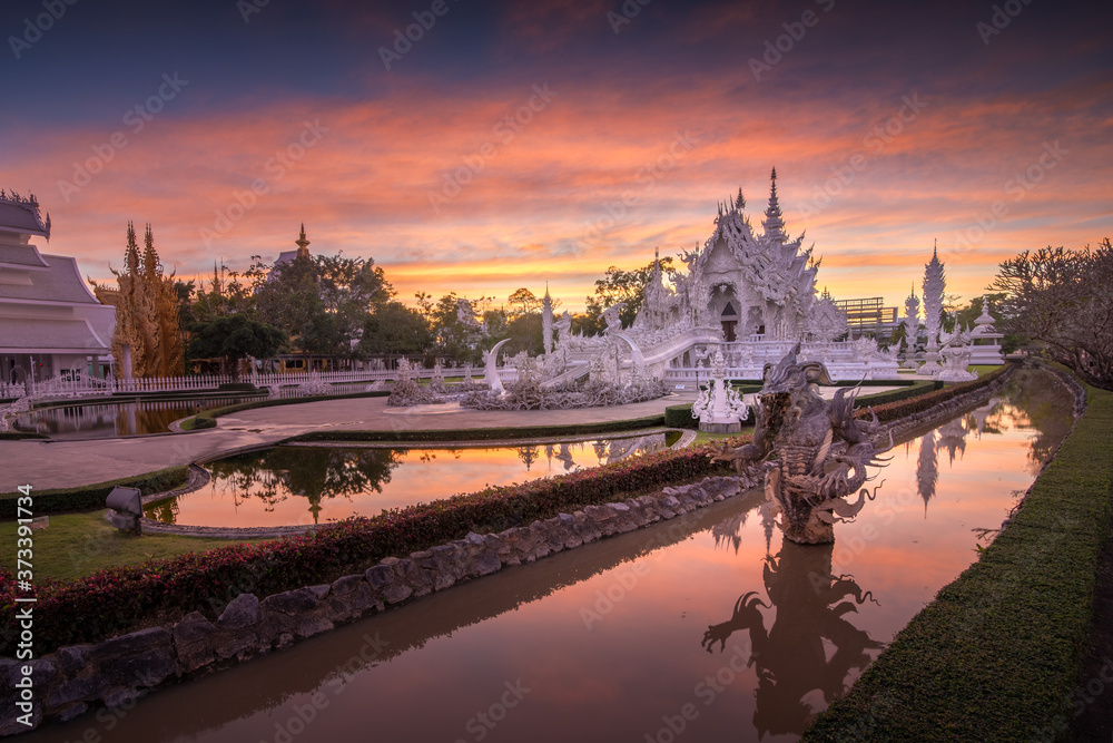 Scenery of Wat Rong Khun or White temple with twilight sky on winter season, Chiangrai, Thailand.